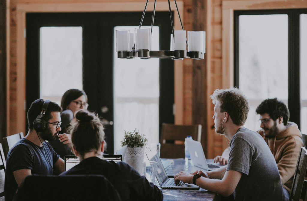 HR consulting employee sitting around table to increase engagement